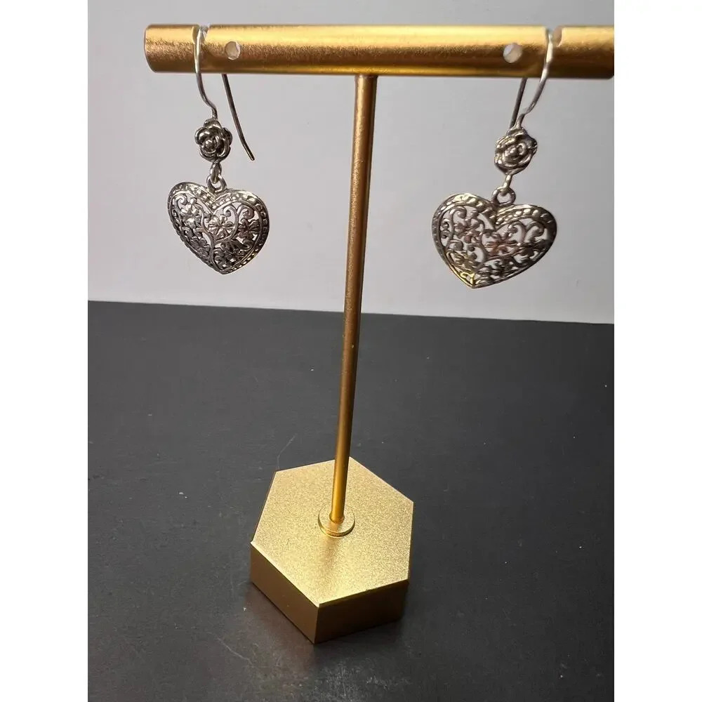 Sterling silver heart shaped earrings with floral design